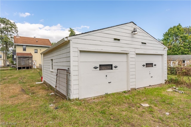 garage with a lawn