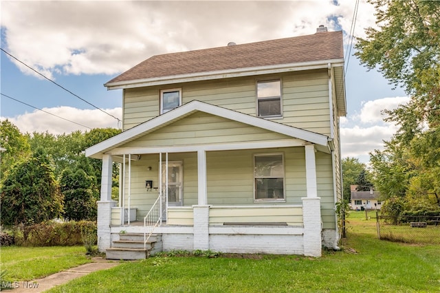 view of front facade with a porch and a front lawn