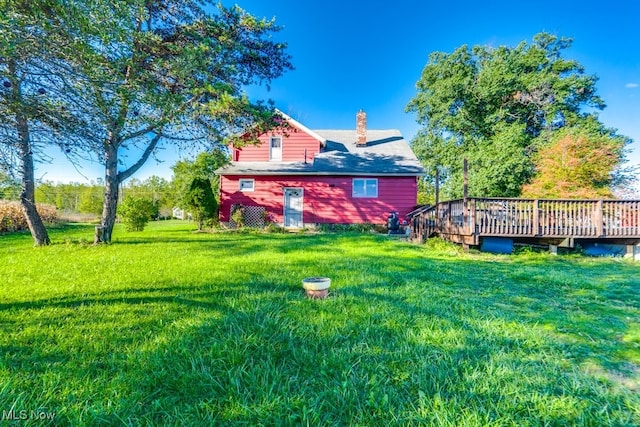 view of yard with a deck