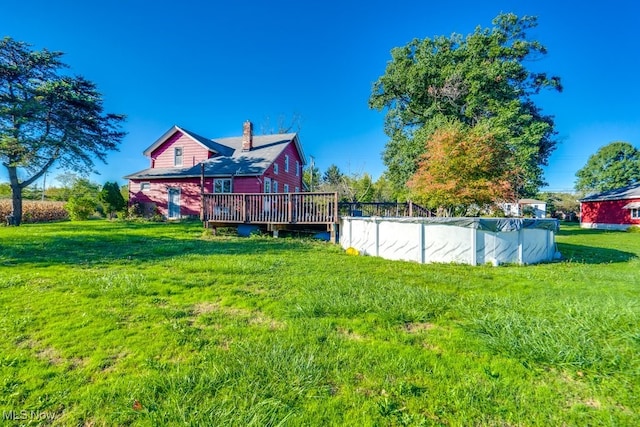 view of yard featuring a pool side deck