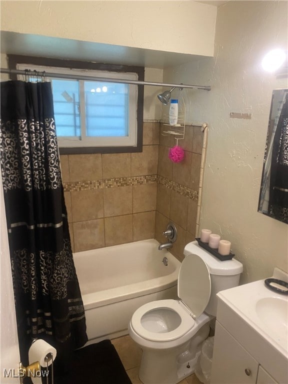 full bathroom with shower / bath combination with curtain, tile patterned flooring, vanity, and toilet