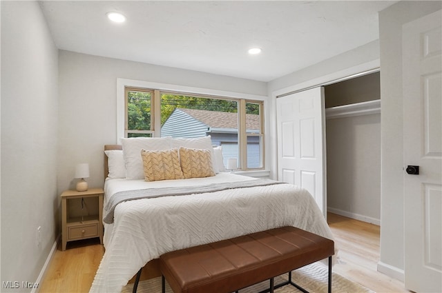 bedroom with a closet and light wood-type flooring