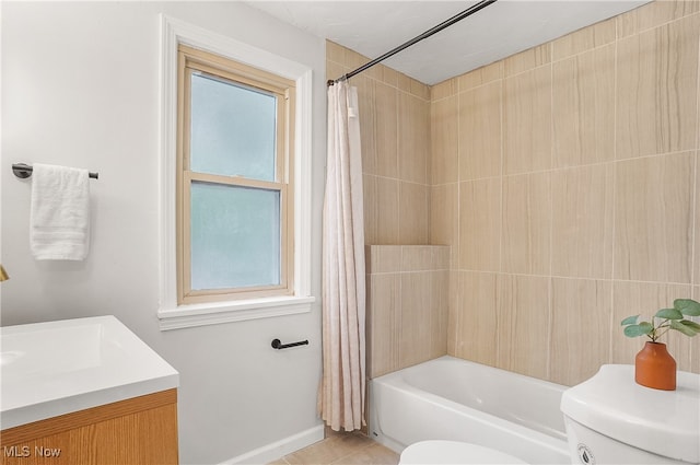 full bathroom with vanity, toilet, shower / bath combo with shower curtain, and tile patterned flooring