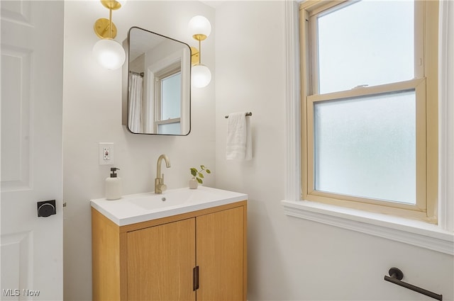 bathroom with vanity and plenty of natural light