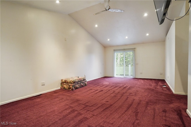 carpeted empty room featuring ceiling fan and high vaulted ceiling