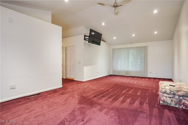 interior space featuring lofted ceiling, carpet flooring, and ceiling fan