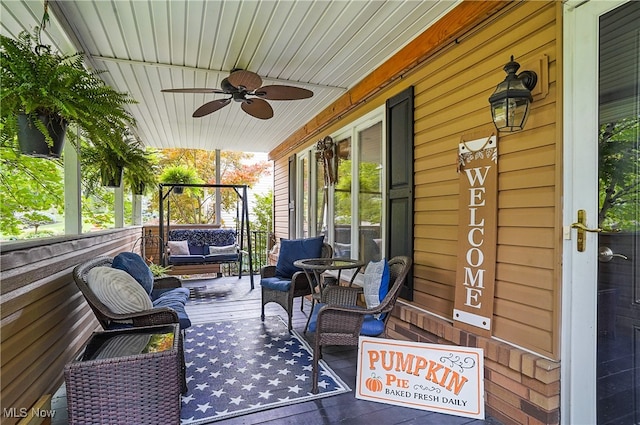 exterior space featuring ceiling fan and a porch