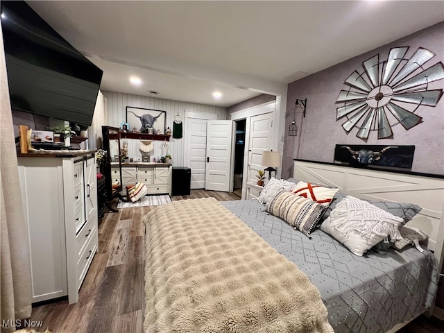 bedroom with hardwood / wood-style floors