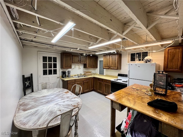 kitchen featuring sink and white appliances