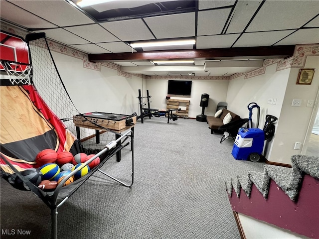 interior space featuring carpet floors and a drop ceiling