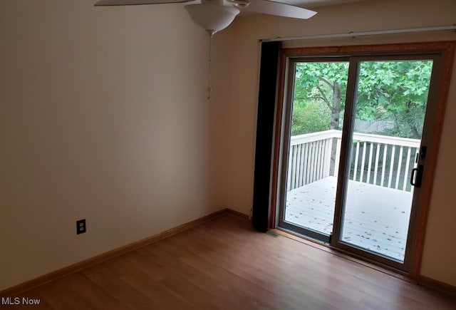 spare room featuring ceiling fan and light hardwood / wood-style flooring