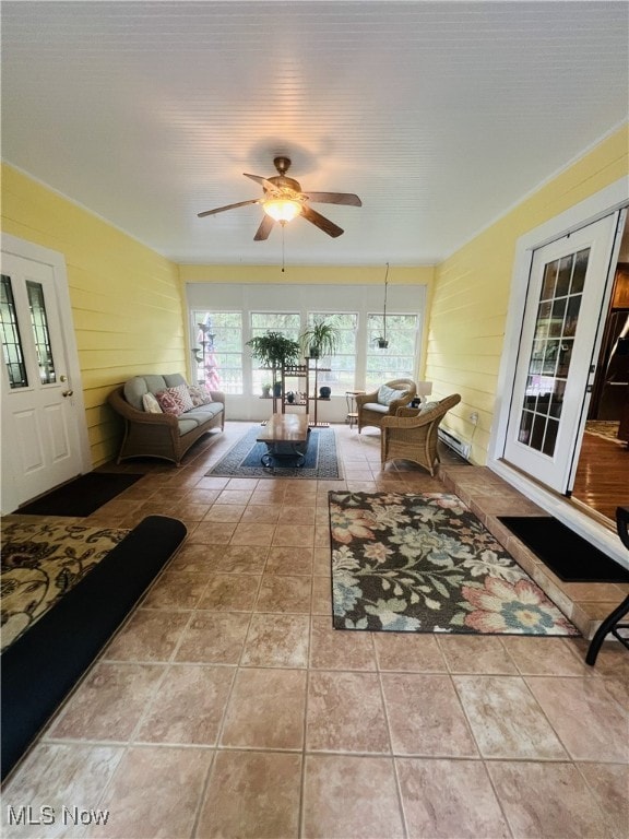 interior space with ceiling fan