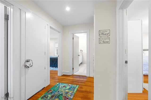 hallway featuring light wood-style floors