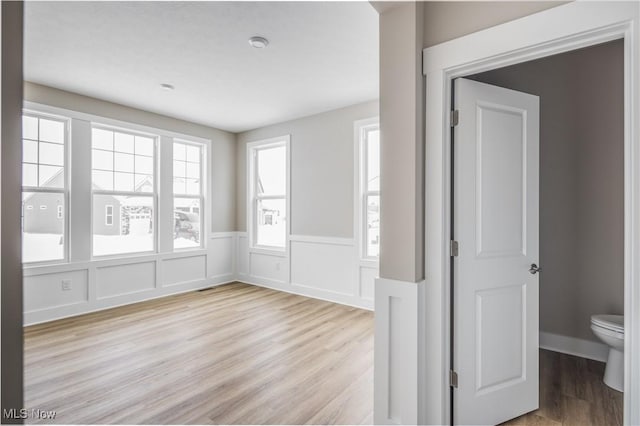 spare room featuring light hardwood / wood-style floors