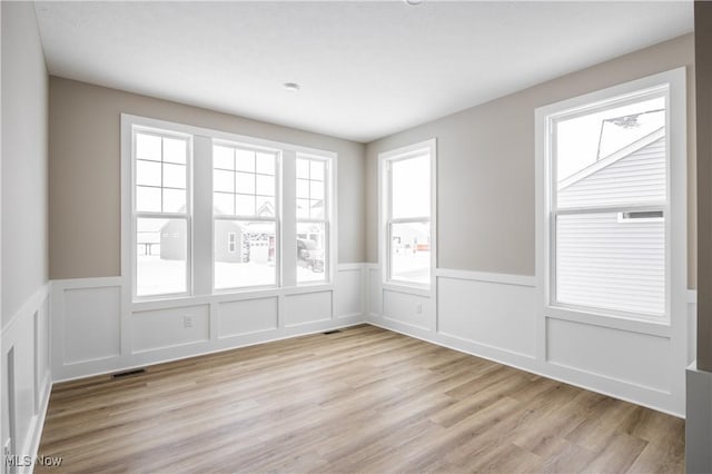 empty room with light wood-type flooring