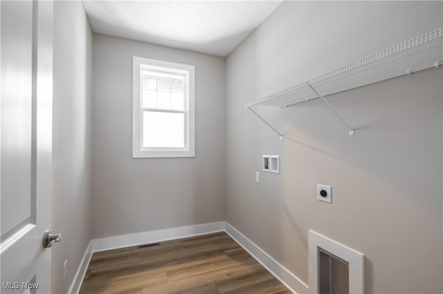 washroom with wood-type flooring, electric dryer hookup, and washer hookup