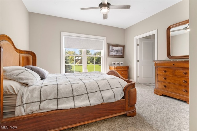 carpeted bedroom with ceiling fan