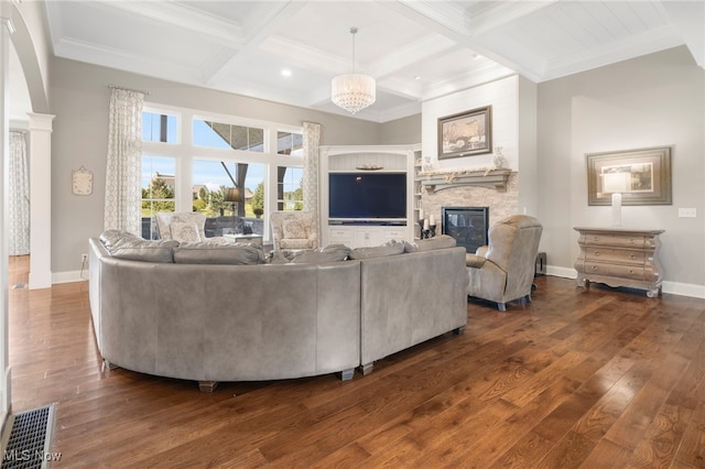 living room featuring crown molding, a fireplace, dark hardwood / wood-style flooring, and beamed ceiling