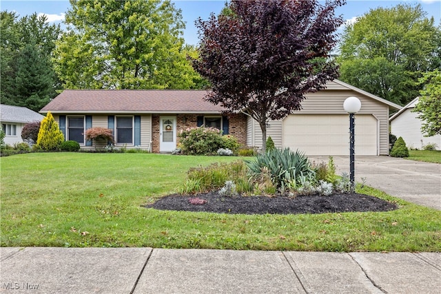 ranch-style home with a garage and a front lawn