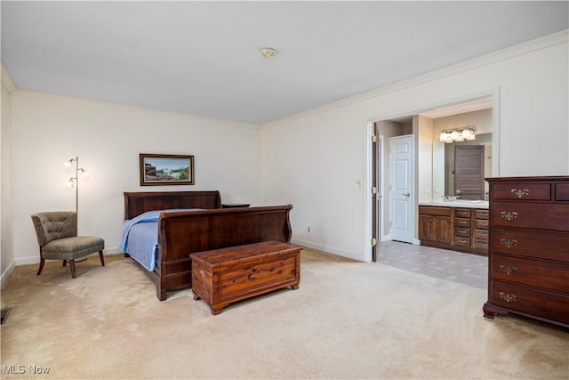 carpeted bedroom featuring crown molding and connected bathroom