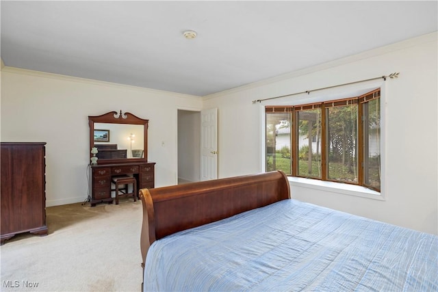 carpeted bedroom with ornamental molding