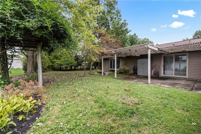 view of yard with a pergola and a patio