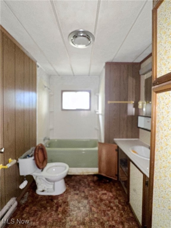 full bathroom with shower / tub combination, wood walls, toilet, and vanity