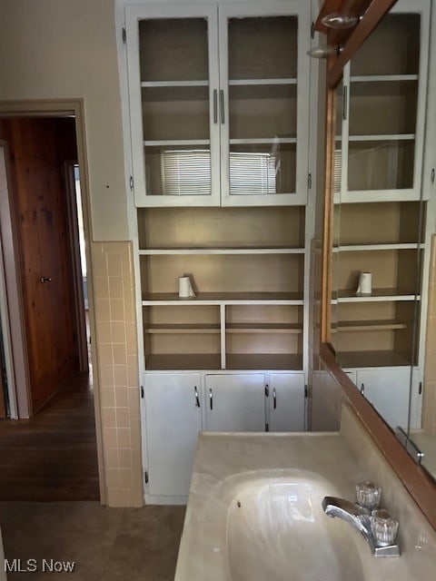 bathroom with vanity and hardwood / wood-style floors