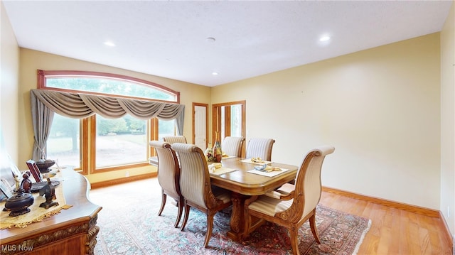 dining space featuring light hardwood / wood-style floors