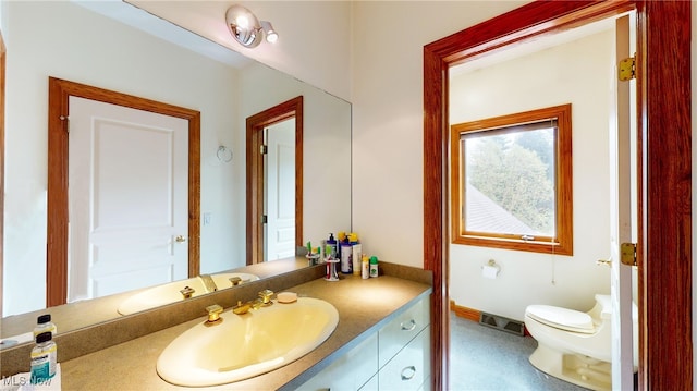 bathroom with vanity and toilet