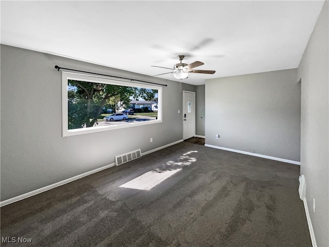 carpeted empty room with ceiling fan