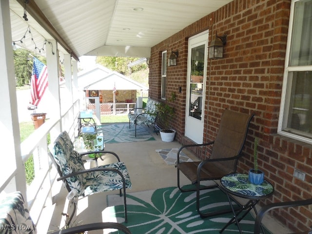 view of patio featuring a porch