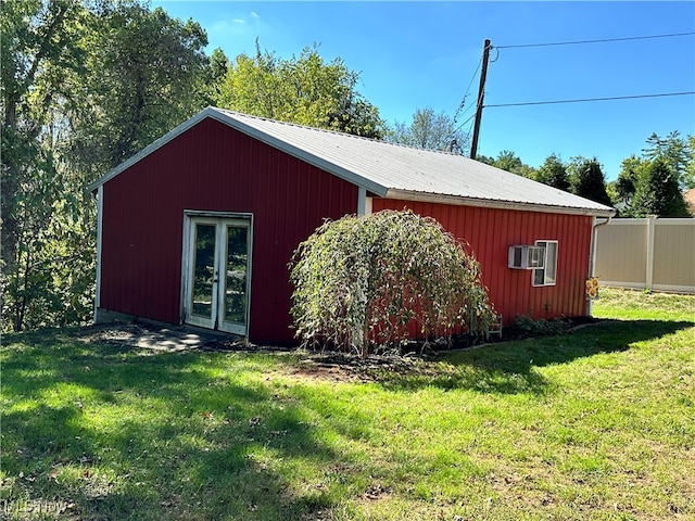 view of outbuilding with a yard