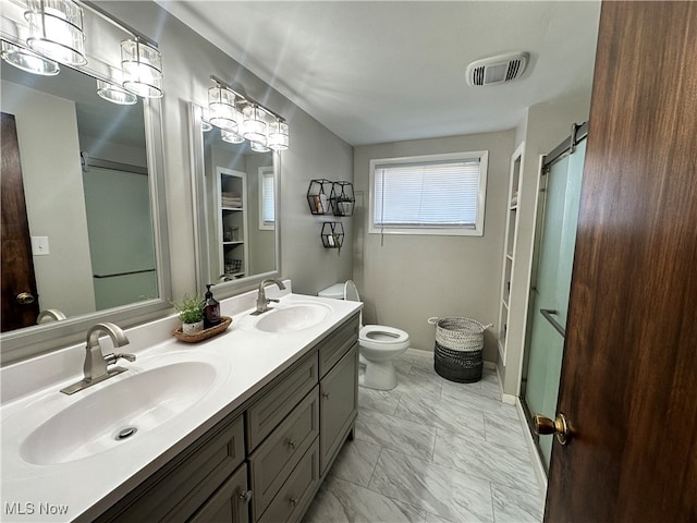 bathroom featuring walk in shower, vanity, and toilet