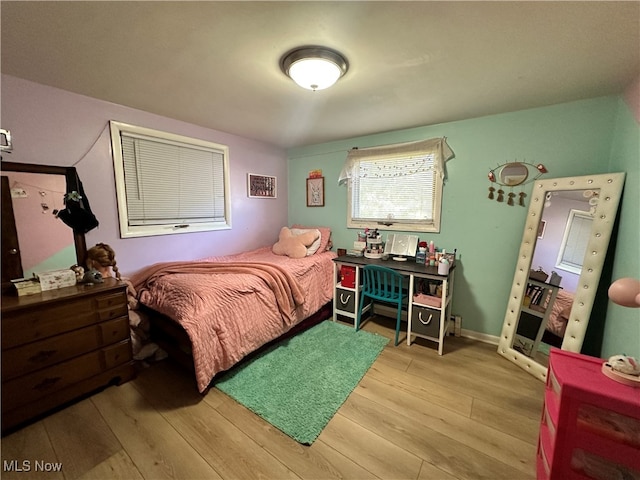 bedroom with light wood-type flooring