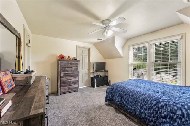 bedroom with carpet, lofted ceiling, and ceiling fan