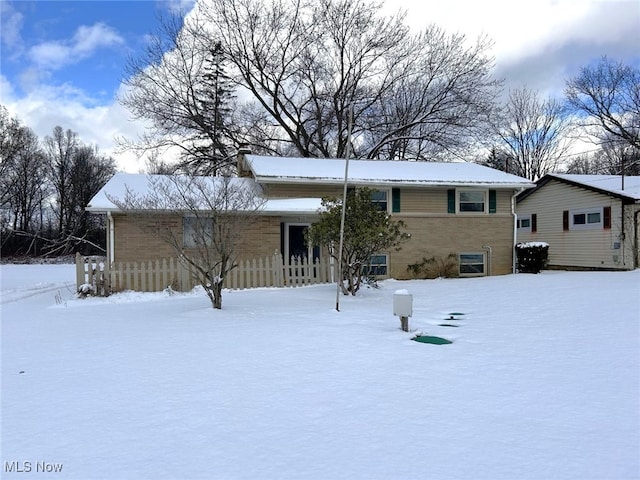 view of snow covered house