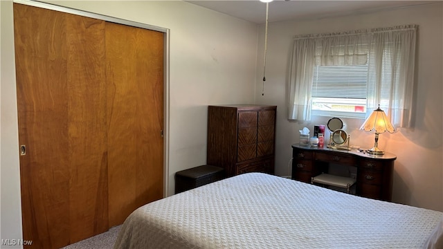 bedroom featuring a closet and carpet flooring