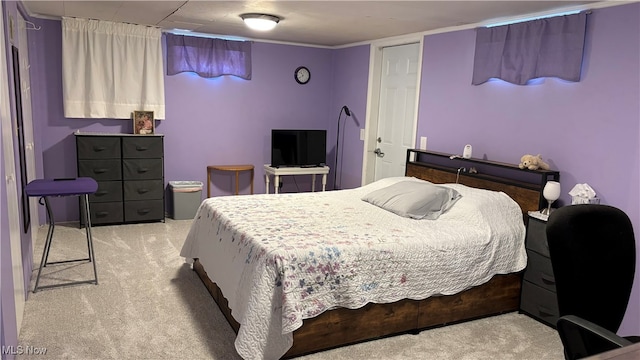 bedroom featuring light carpet