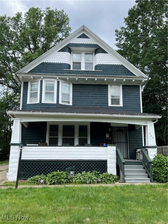 view of front of home with a front lawn and a porch