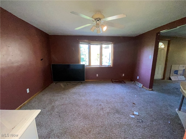 empty room with ceiling fan and carpet flooring