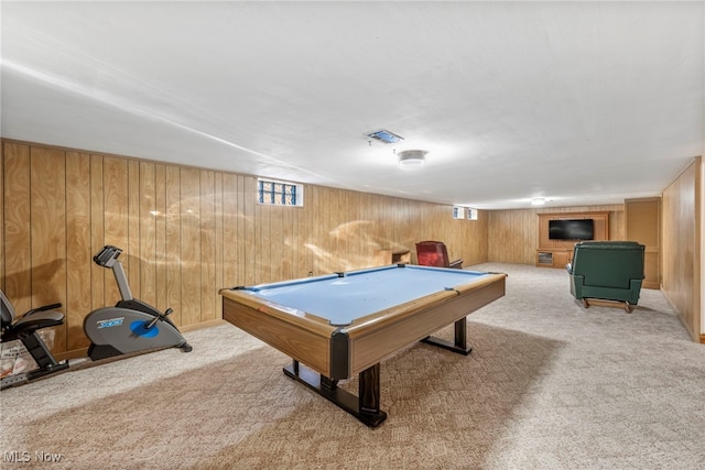 playroom featuring light colored carpet, wood walls, and pool table