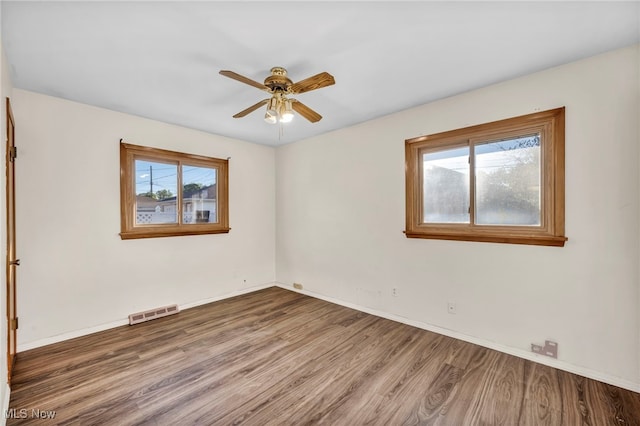 spare room featuring ceiling fan and hardwood / wood-style flooring