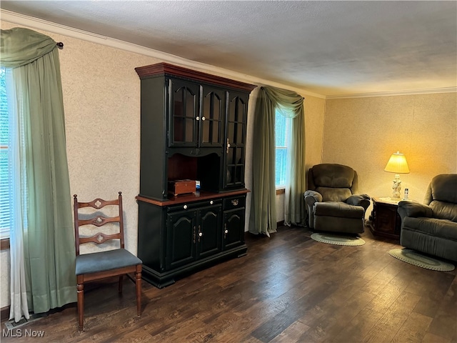 living room featuring ornamental molding, a textured ceiling, and dark wood-type flooring