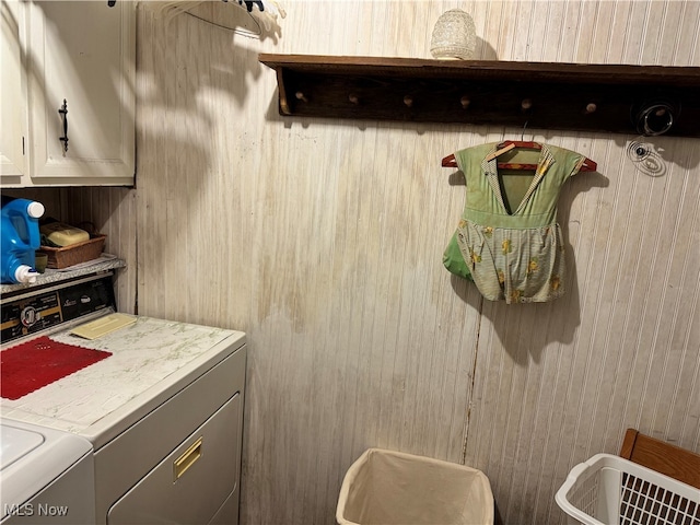 laundry area featuring cabinets and washing machine and dryer