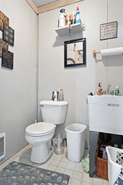 bathroom with sink and toilet