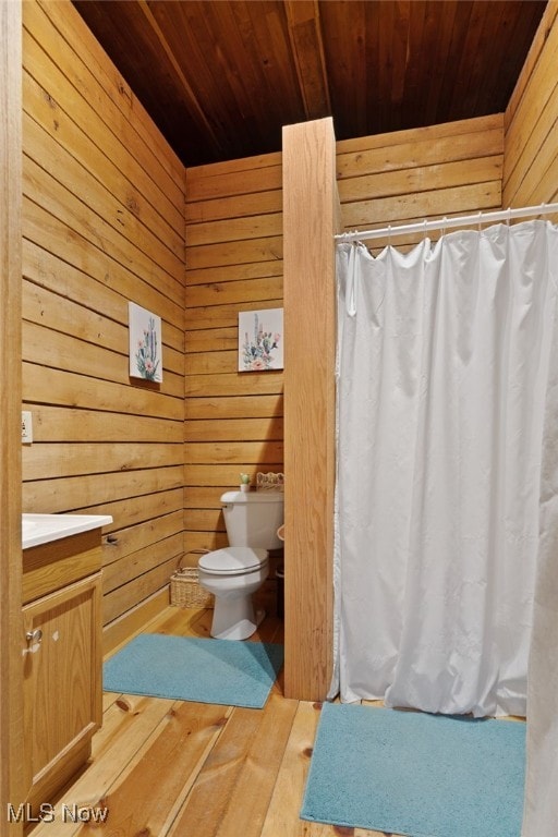 bathroom featuring vanity, wood ceiling, toilet, and hardwood / wood-style flooring