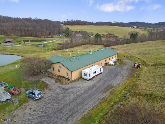 birds eye view of property with a rural view