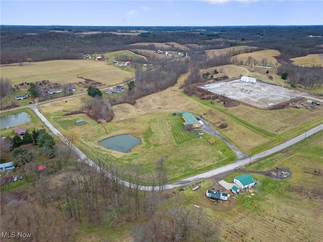 drone / aerial view with a rural view and a water view