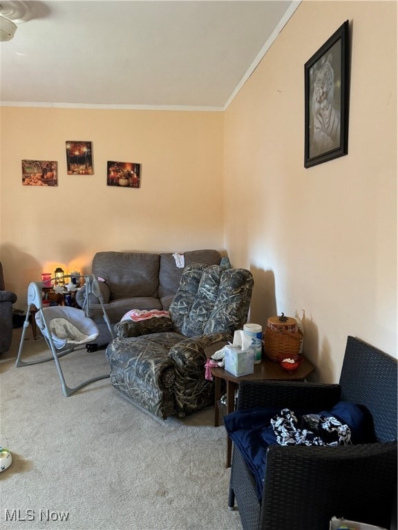 carpeted living room featuring crown molding